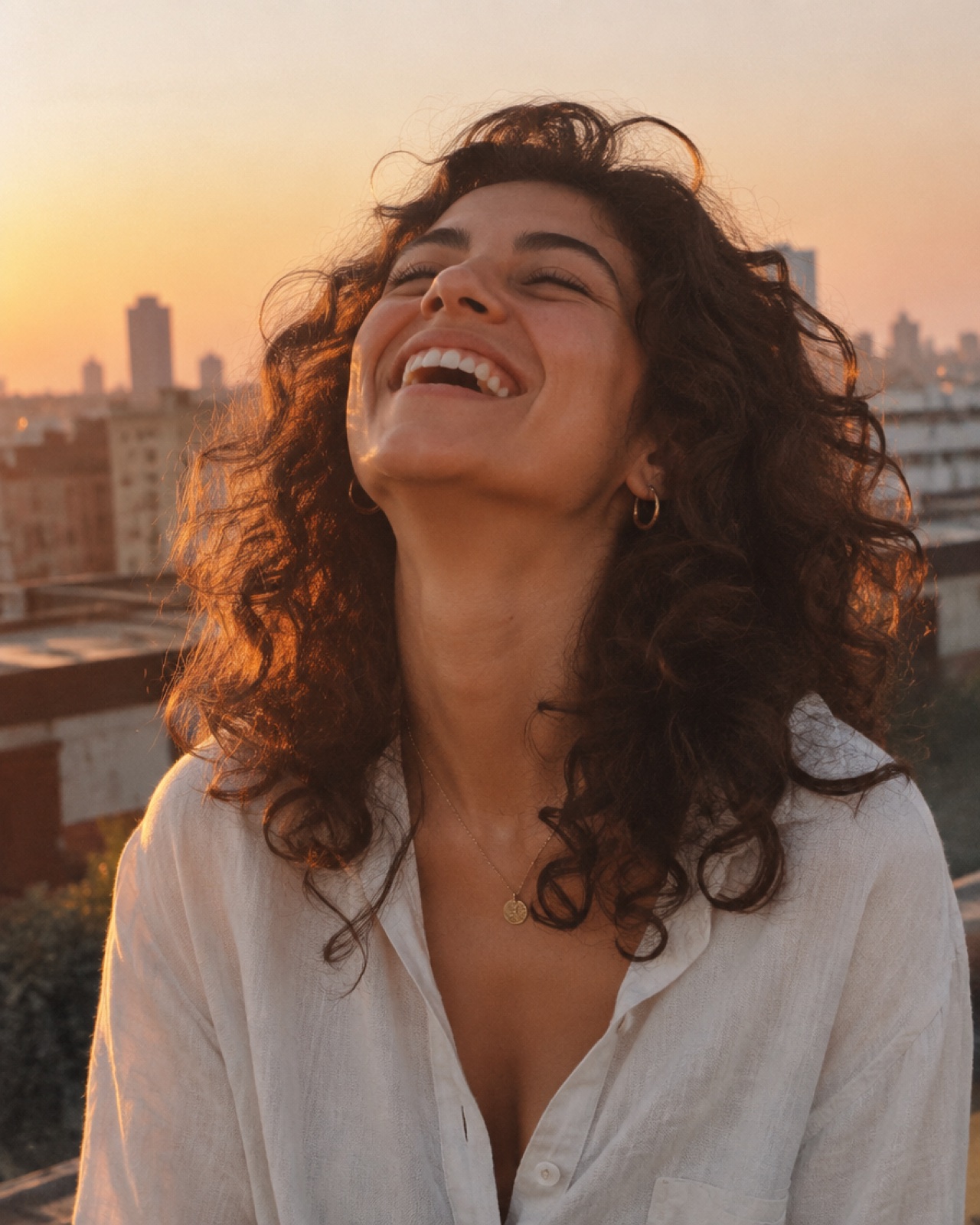 Maya: Your roof, golden hour, mid-laugh ☀️
